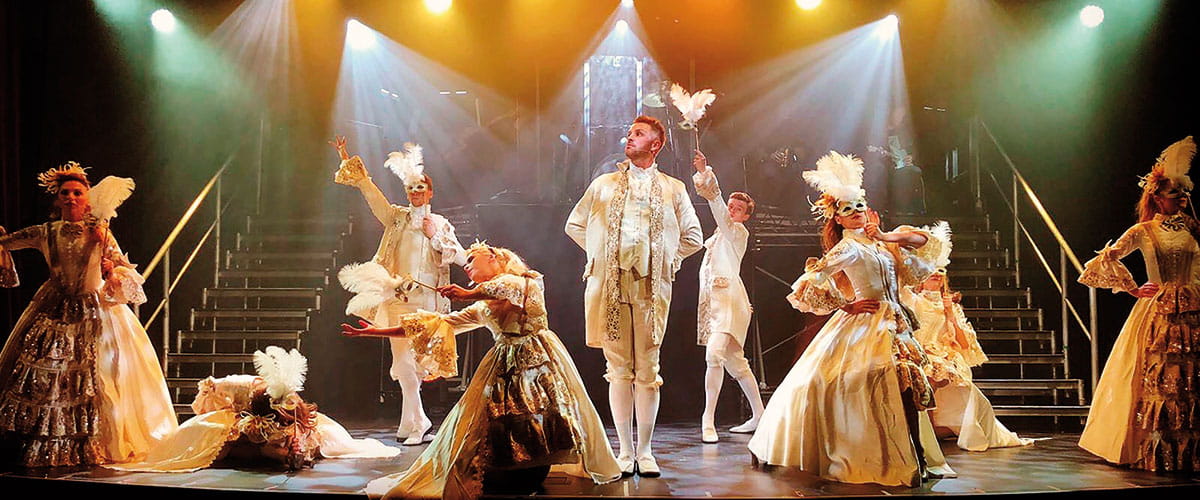 Performers on stage in the Playhouse on Spirit of Discovery